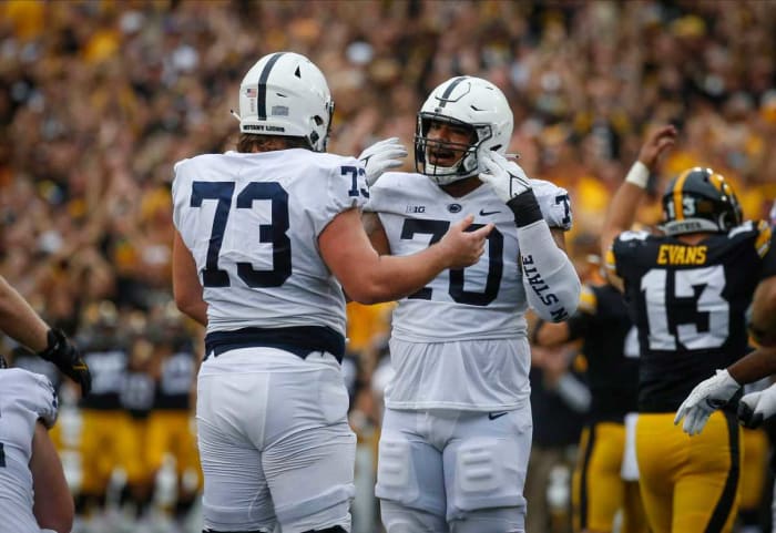 Penn State offensive linemen Mike Miranda, left, and Juice Scruggs complain about the Iowa Hawkeyes fan noise after committing a false start penalty in the second quarter against Iowa at Kinnick Stadium in Iowa City, Iowa, on Saturday, Oct. 9, 2021. 20211009 Iowavspennstate