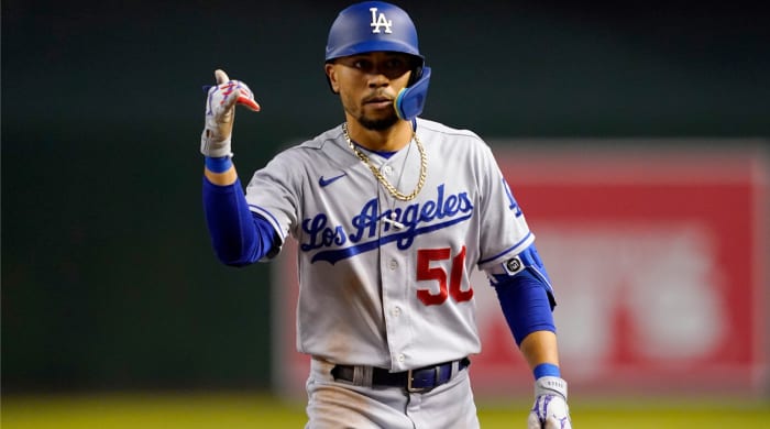 Los Angeles Dodgers' Mookie Betts (50) motions to his dugout after a base hit against the Arizona Diamondbacks during the sixth inning of a baseball game, Thursday, May 26, 2022, in Phoenix.  (AP Photo/Matt York)