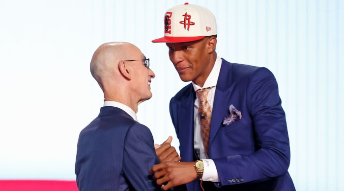 Jabari Smith meets Adam Silver on the stage at the 2022 NBA Draft.