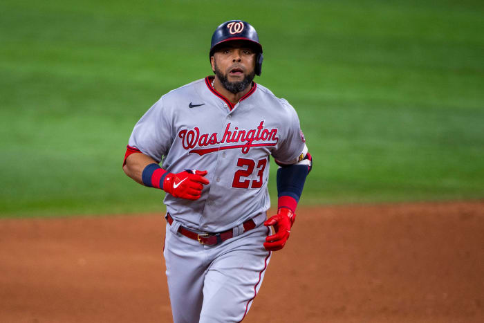 June 25, 2022;  Arlington, Texas, USA;  Washington Nationals designated hitter Nelson Cruz (23) rounds the bases after hitting a two-run home run against the Texas Rangers during the sixth inning at Globe Life Field.