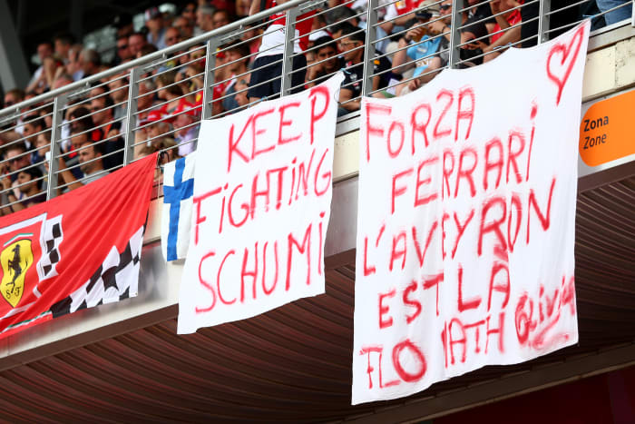 Fans hang a banner encouraging Schumacher to “keep fighting” at a 2014 Formula One race in Spain.
