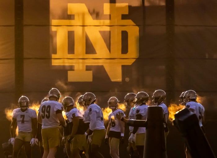 Notre Dame players take to the field in South Bend for spring football training.