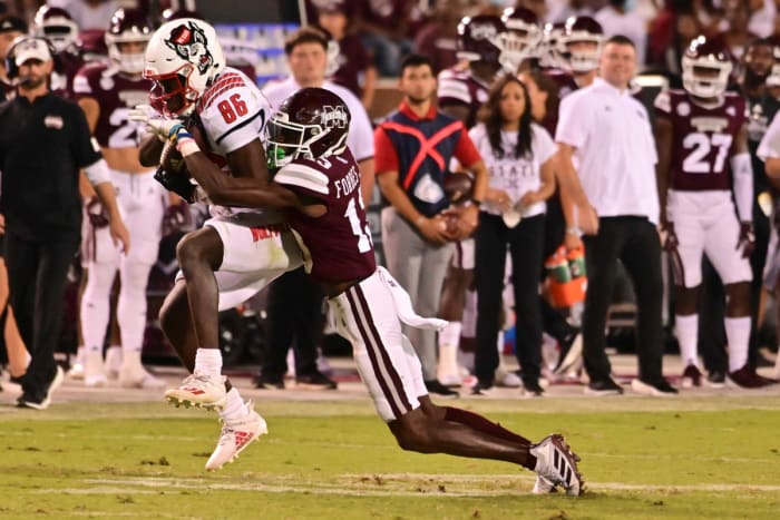 09/11/2021;  Starkville, Mississippi, USA;  North Carolina State Wolfpack wide receiver Emeka Emezie (86) is tackled by Mississippi State Bulldogs cornerback Emmanuel Forbes (13) in the fourth quarter at Davis Wade Stadium in Scott Field.  Mandatory Credit: Matt Bush-USA TODAY Sports