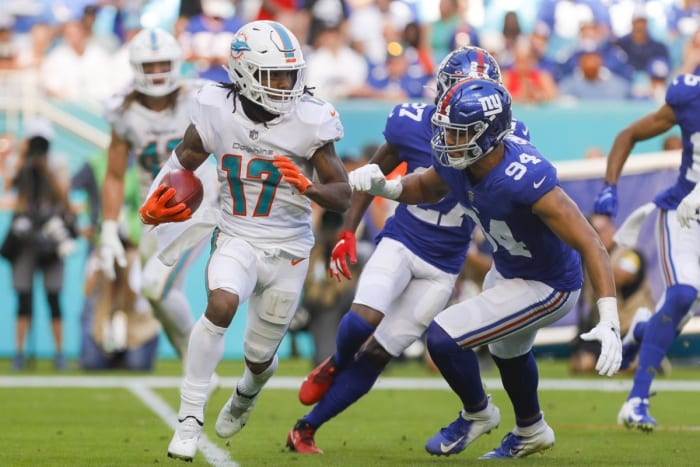 December 5, 2021;  Miami Gardens, Florida, USA;  Miami Dolphins wide receiver Jalen Waddle (17) runs with the ball against New York Giants defensive end Ellerson Smith (94) during the second half at Hard Rock Stadium.