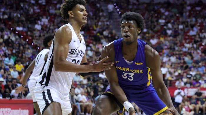James Wiseman # 33 of the Golden State Warriors runs against Dominick Barlow # 26 of the San Antonio Spurs at the 2022 NBA Summer League at the Thomas & Mack Center on July 10, 2022 in Las Vegas, Nevada.