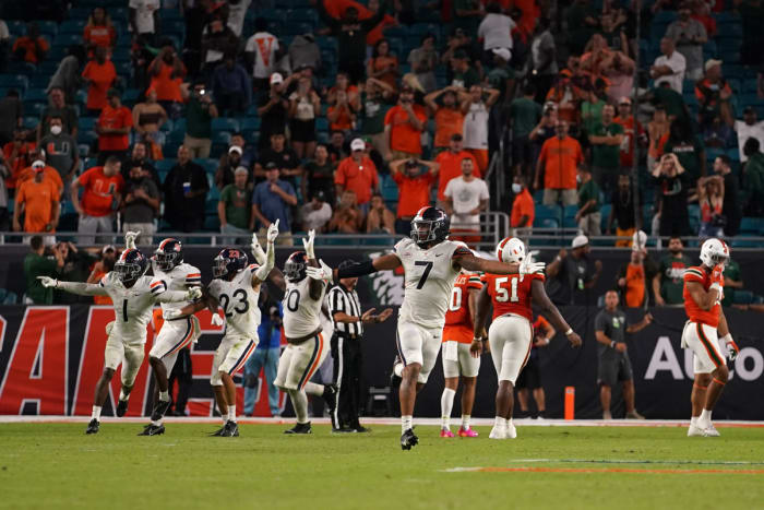 Virginia Cavaliers outside linebacker Noah Taylor (7) celebrates after Miami Hurricanes kicker Andres Borregales (30) misses the game-winning goal during the second half at Hard Rock Stadium.
