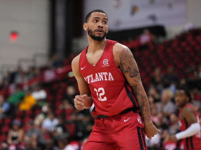 Atlanta Hawks guard Tyrese Martin reacts to a teammate's shot.