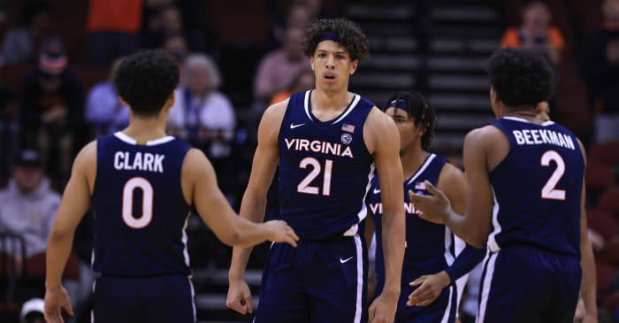 Virginia Cavaliers forward Kadin Shedrick (21) goes for a layup in front of guard Kihei Clark (0) and guard Reece Beekman (2) during the second half against the Georgia Bulldogs at the Prudential Center.