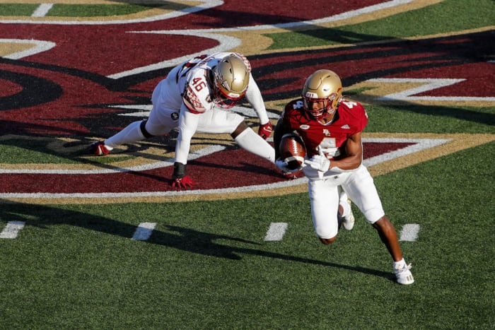 Boston College Eagles wide receiver Zay Flowers (4) drives past Florida State Seminoles linebacker DJ Lundy (46) during the second half at Alumni Stadium.