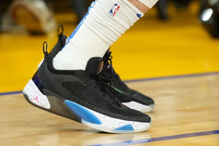 View of the black and blue Jordan Luka shoes.