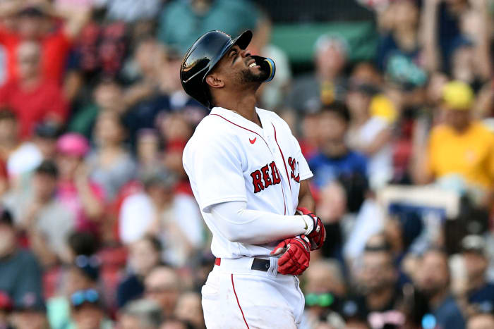 July 23, 2022; Boston, Massachusetts, USA; Boston Red Sox shortstop Xander Bogaerts (2) was thrown by Toronto Blue Jays relief pitcher Adam Cimber (90) in the eighth inning at Fenway Park. React after being hit by the pitch.