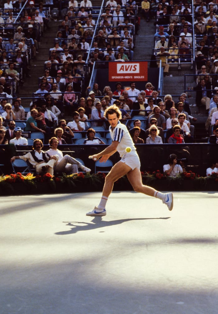 John McEnroe (USA) looks to hit a backhand groundstroke against Bj rn Borg (SWE) (not pictured) during the 1994 US Open Men's Final at the USTA National Tennis Center.  McEnroe defeated Borg (4-6, 6-2, 6-4, 6-3).