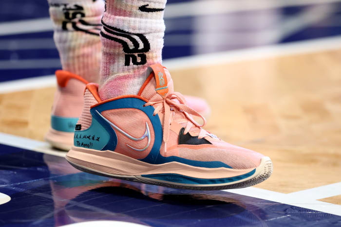 View of the pink Kyrie Low 5 basketball shoes.