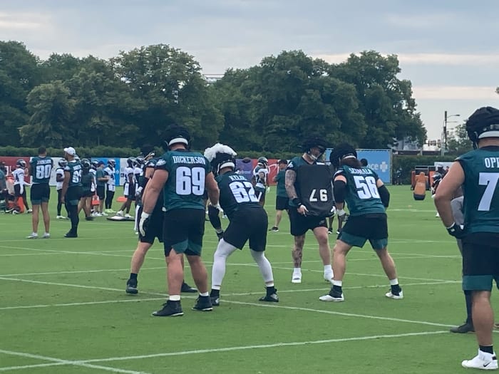 Landon Dickerson (left), Jason Kelce, and Isaac Seumalo prepare to execute a drill during practice on July 20, 2022