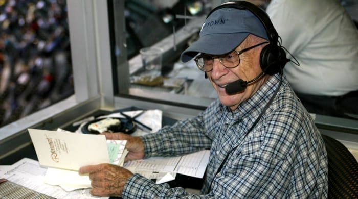 Detroit Tigers announcer Ernie Harwell in the broadcast booth on September 16, 2002, after leaving the game early to check on his wife, Lulu, who had become ill during the Tigers' celebration in his honor the previous day.