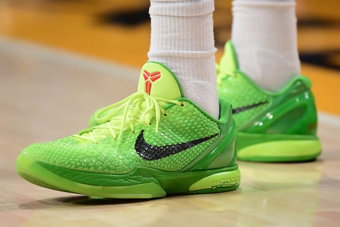 View of green Nike Kobe shoes.