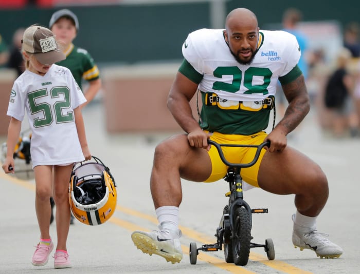 Running back AJ Dillon takes a slightly undersized bike to Packers training camp.  (Dan Powers/USA Today Sports Images)
