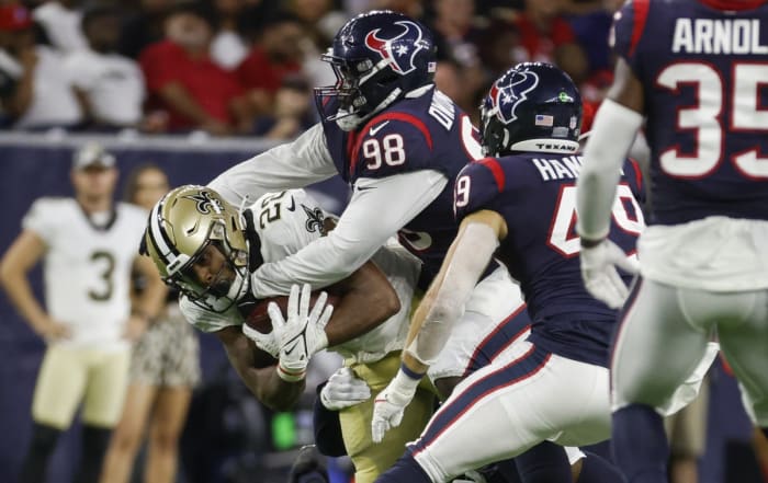 Houston Texans defensive end Michael Dumfor (98) tackles New Orleans Saints running back Devine Ogibo (28). Required Credit: Troy Taormina-USA TODAY Sports