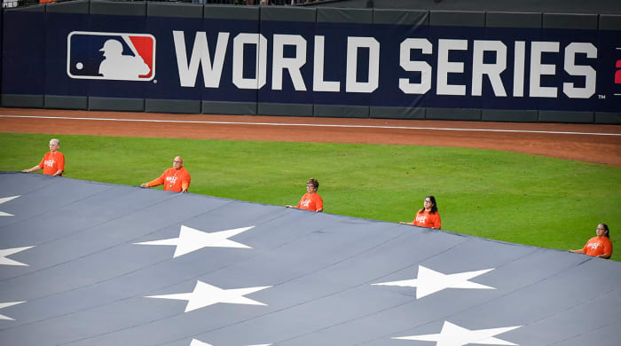 A view of the U.S. flag and World Series logo during the National Anthem before Game 1 of the 2021 World Series at Minute Maid Park between the Astros and the Braves.