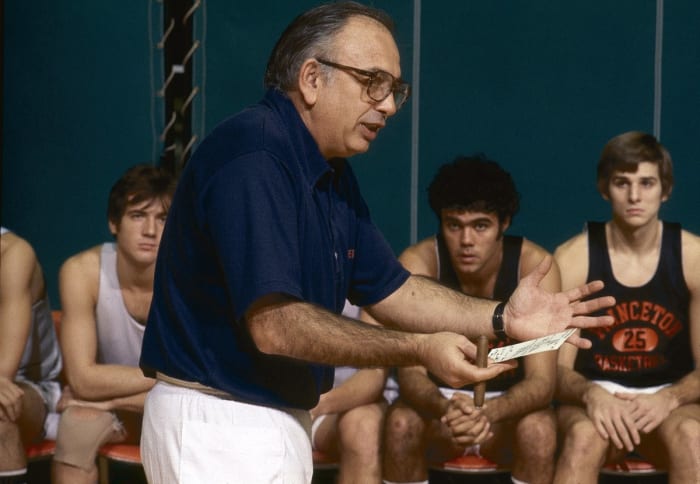 Pete Carril directs his players through a play scheme.