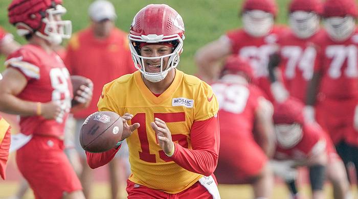 Patrick Mahomes takes a snap during training camp