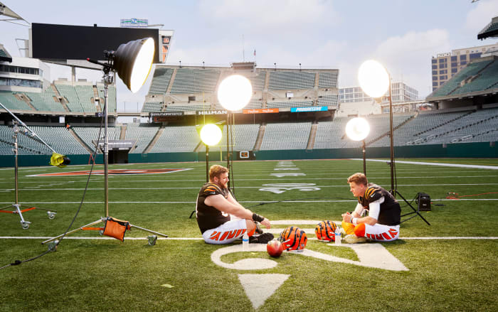 Joe Burrow and new Bengals center Ted Karras sit and talk during a break in a Sports Illustrated photo shoot