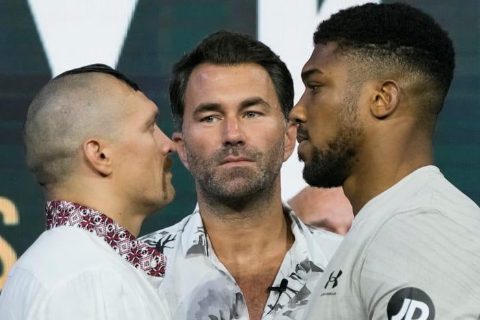Heavyweight boxers Anthony Joshua of Great Britain (right) and Oleksandr Usyk of Ukraine (left) face off at the weigh-in at King Abdullah Sports City.