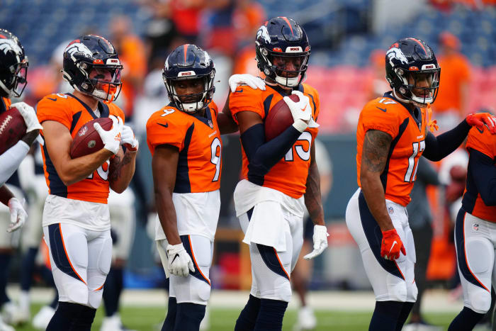 Members of the Denver Broncos before a preseason game against the Dallas Cowboys at Mile High's Empower Field.