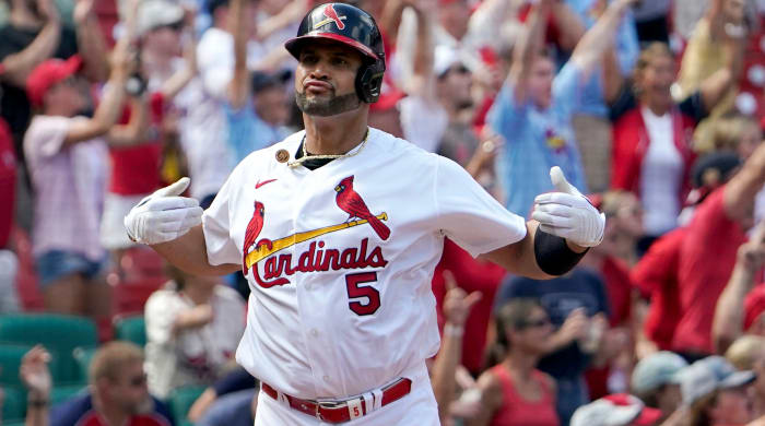 St.  Louis Cardinals' Albert Pujols celebrates after hitting a three-run home run during the eighth inning of a baseball game against the Milwaukee Brewers Sunday, Aug.  14, 2022, in St.  Louis.
