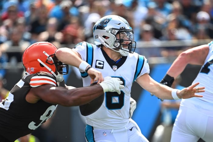 Sep 11, 2022; Charlotte, North Carolina, USA; Cleveland Browns defensive end Myles Garrett (95) strips the ball from Carolina Panthers quarterback Baker Mayfield (6) in the third quarter at Bank of America Stadium. Mandatory Credit: Bob Donnan-USA TODAY Sports