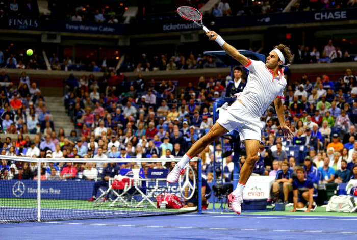 Roger Federer returns a shot against Novak Djokovic in the 2015 US Open men's final.