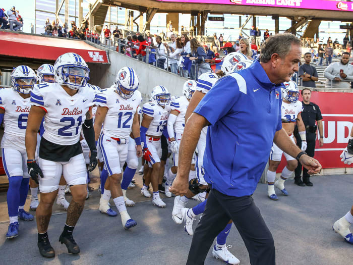 Sonny Dykes walks out with his 2021 SMU team