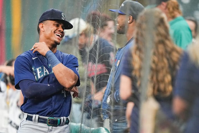 Julio Rodríguez laughs with Mariners fans in Cleveland during a rain delay on Sept. 4, 2022.