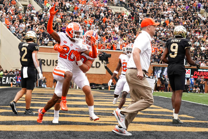 Clemson cornerback Nate Wiggins, 20, made a fourth down pass to Wake Forest wide receiver AT Perry, 9, in the second overtime of an NCAA college football game in Winston-Salem, North Carolina. congratulated by teammate Keith Maguire, 30, after knocking down the  , Saturday, September 24, 2022. Clemson won his double overtime 51-45.  (AP Photo/Chuck Burton)