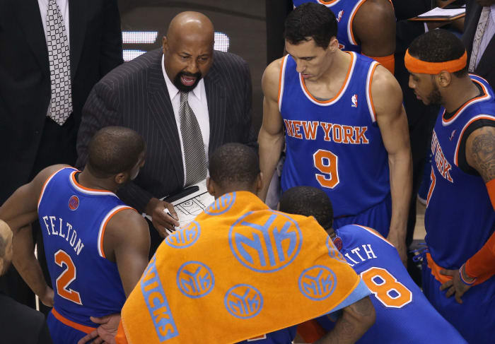 April 11, 2014;  Toronto, Ontario, Canada;  New York Knicks head coach Mike Woodson talks with his players during a layover against the Toronto Raptors at Air Canada Center.  The Knicks defeated the Raptors 108-100.  Mandatory credit: Tom Szczerbowski-USA TODAY Sports