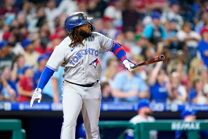 Toronto Blue Jays' Vladimir Guerrero watches after scoring three home runs against Philadelphia Phillies player Seranthony Dominguez during the eighth inning of a baseball game, Wednesday, Sept. 21, 2022, in Philadelphia.