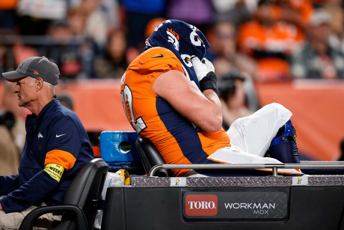 Denver Broncos offensive tackle Garett Bolles (72) is carted off the field in the fourth quarter against the Indianapolis Colts at Empower Field at Mile High.