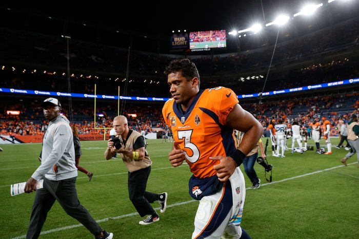 Denver Broncos quarterback Russell Wilson (3) runs off the field after the game against the Indianapolis Colts at Empower Field at Mile High.