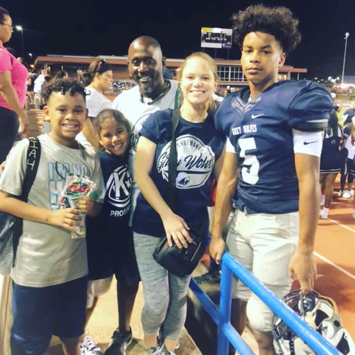 Baldwin and family mother Mandy, father Avion, and siblings after watching a Shoemaker game in 2019.
