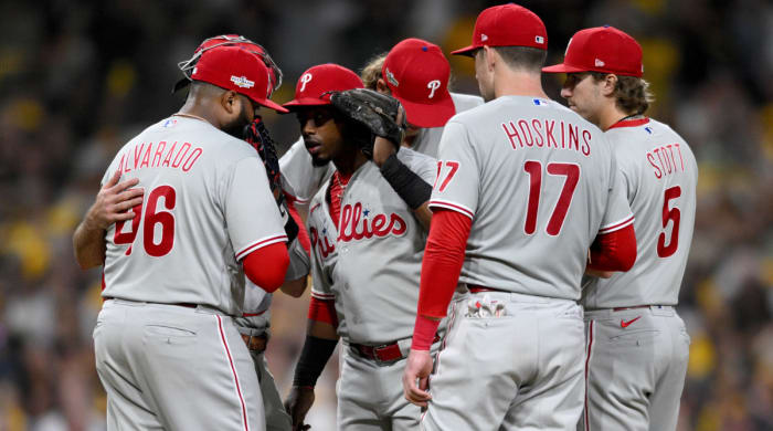 Phillies players gather at the mound during the ninth inning of Game 1 of the 2022 NLCS.