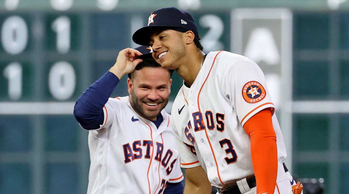 Astros players Jose Altuve, left, and Jeremy Peña celebrate Houston's victory in the first game of the 2022 ALCS Championship.