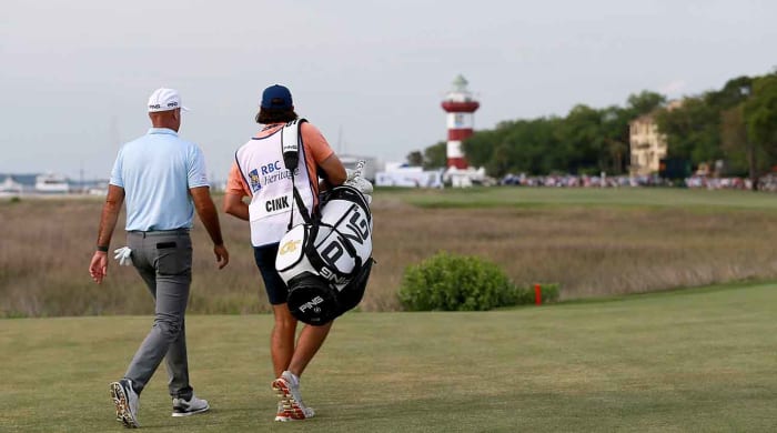 Stewart Cink and his caddy walk up the 18th hole at Harbor Town Golf Links at the 2021 RBC Heritage.