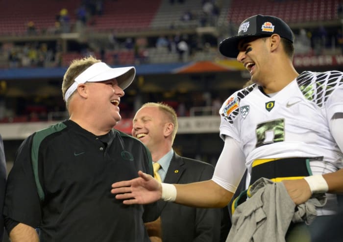 Chip Kelly and Marcus Mariota celebrate their Fiesta Bowl win in 2013.