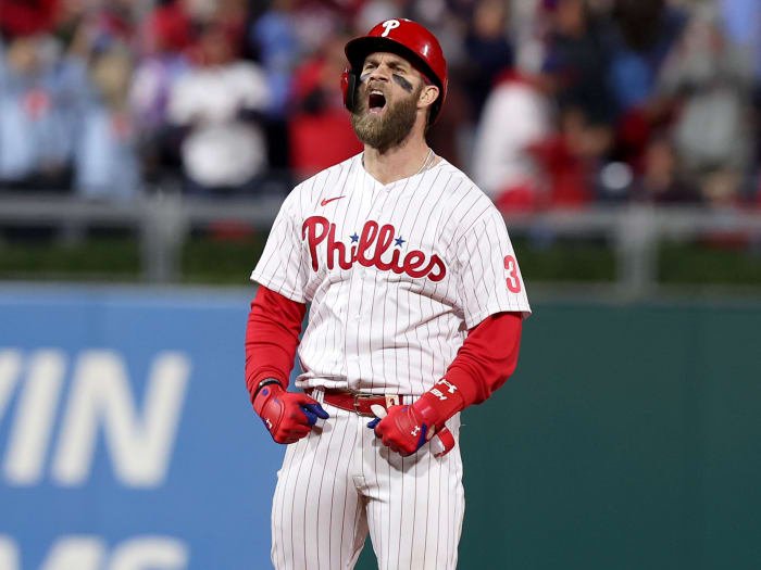 Phillies slugger Bryce Harper reacts after hitting an RBI double against the Padres in Game 4 of the NLCS.