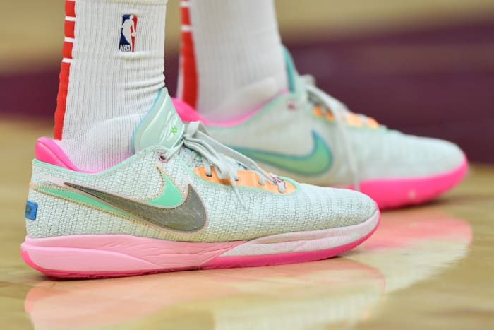 Light green and pink Nike LeBron shoes.