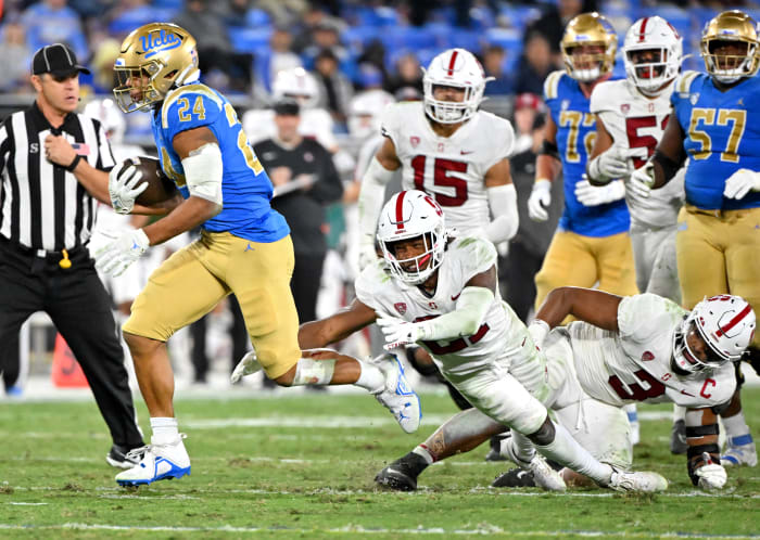 ; UCLA Bruins running back Zach Charbonnet (24) runs for a touchdown against the Stanford Cardinal in the second half at the Rose Bowl.