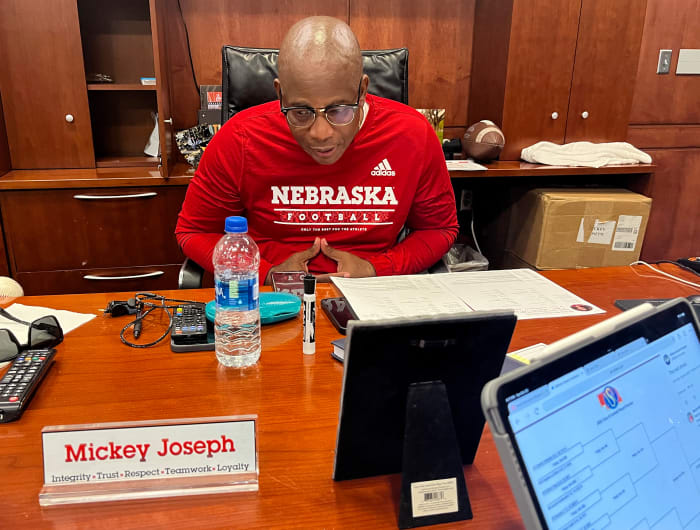 Mickey Joseph talks during a conference call with his staff.