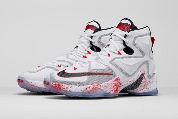 White, red, and black Nike LeBron shoes.