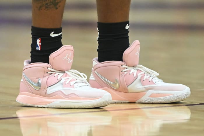View of the pink and white Nike Kyrie shoes.