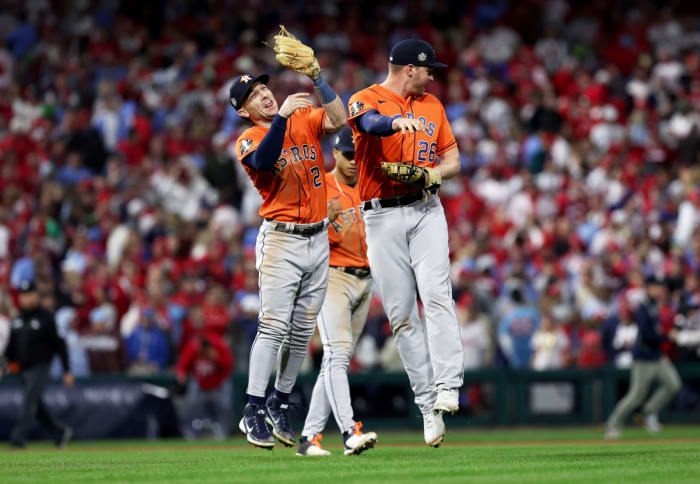 Astros third baseman Alex Bregman (left) and first baseman Trey Mancini celebrate after beating the Phillies in Game 5 of the World Series.